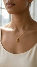 Load image into Gallery viewer, Sterling Silver Wishbone Dainty Pendant on Model
